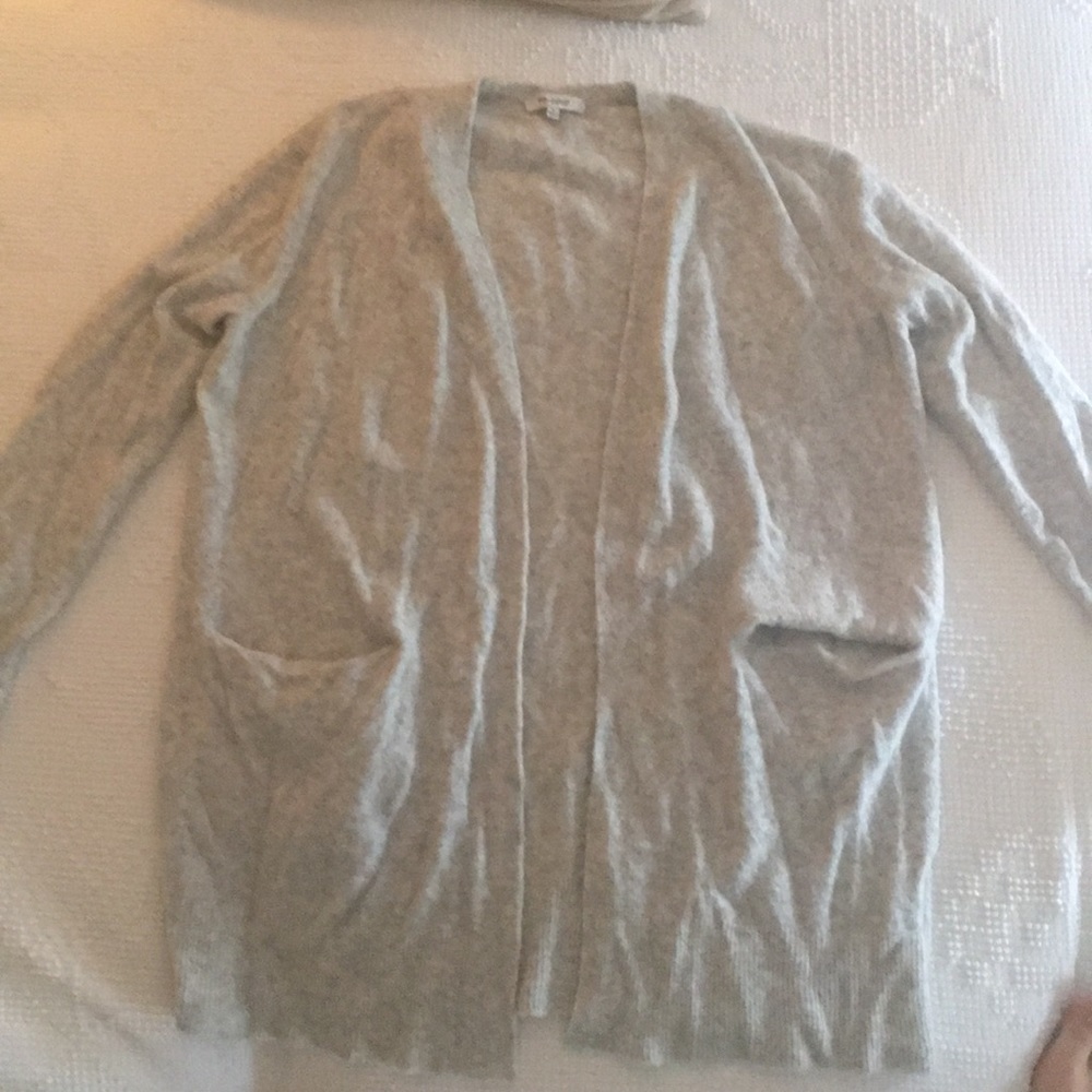 grey cardigan.